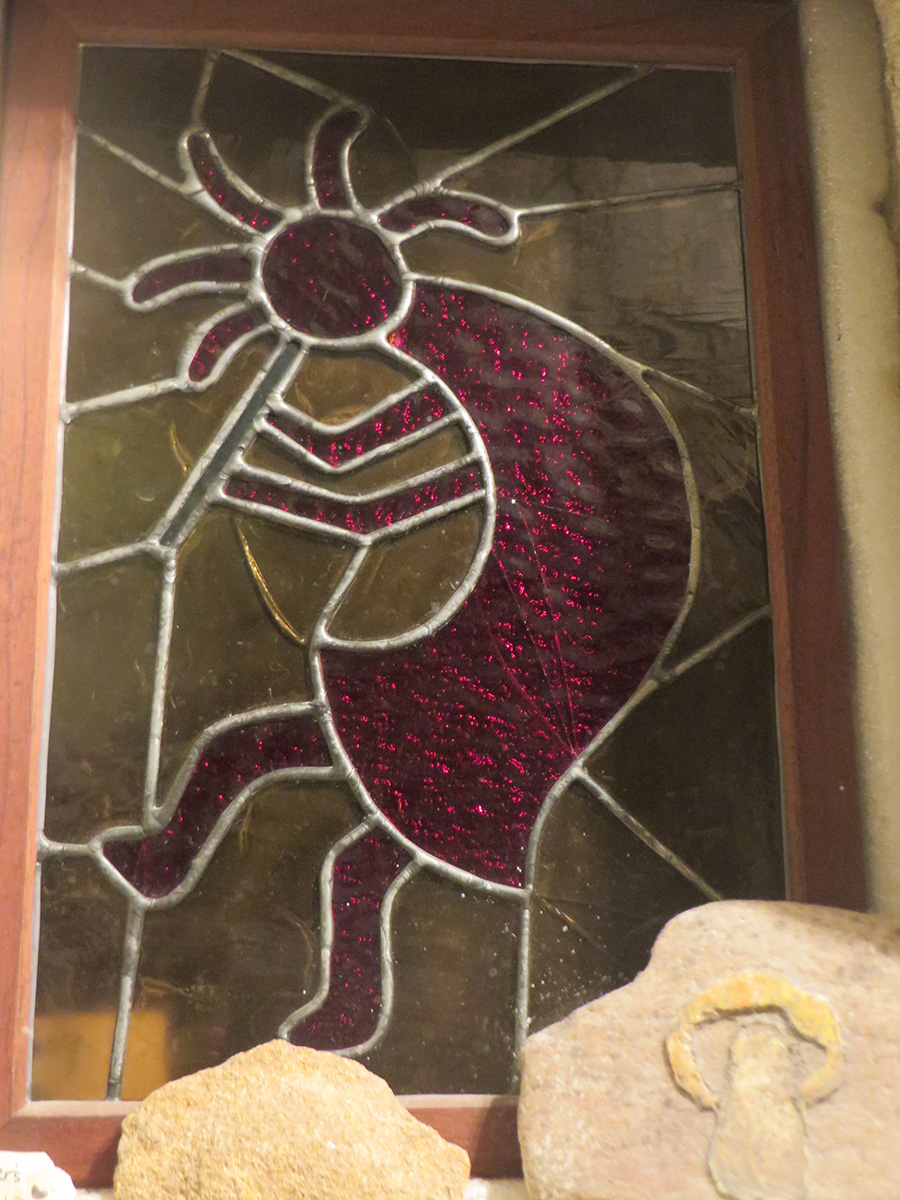 deborah_stone_kokopelli_fertility deity_stained_glass TravelWorld